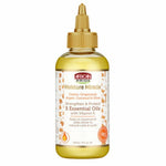 Bottle of African Pride Moisture Miracle hair oil on a white background