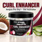 Ampro Pro Styl Curl Enhancer Gel Activator in a clear plastic jar with a black lid and black label, shown with coconut and aloe vera props and large product text at the top.