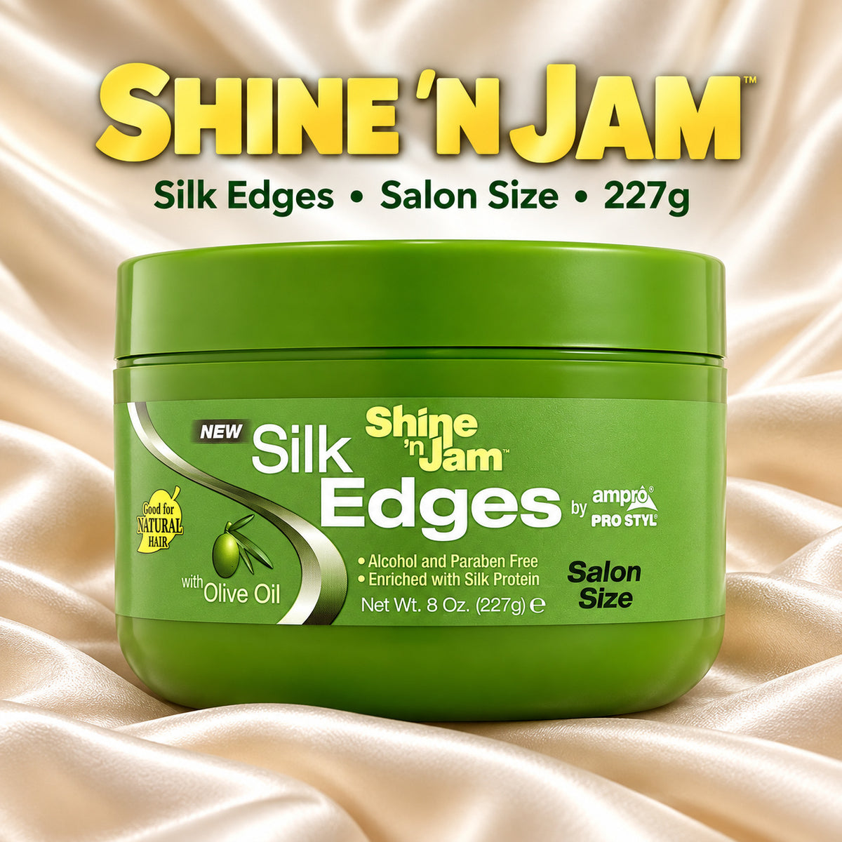 A green jar of Shine 'N Jam Silk Edges salon size hair product, displayed on a draped champagne satin background with the brand name and product details printed above.