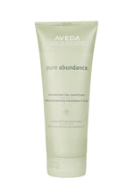 Aveda pure abundance volumizing clay conditioner tube on a white background