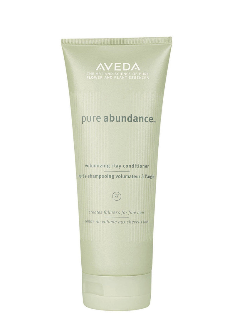 Aveda pure abundance volumizing clay conditioner tube on a white background
