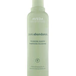 Aveda pure abundance volumizing shampoo bottle on a white background