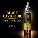 A bottle of Style by Style Black Castor Oil Hair & Body Care, 4.2 oz, displayed on a reflective black surface with gold text on the left.