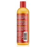 Bottle of Argan oil with a red cap on a white background