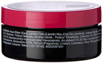 Back view of a cosmetic jar with a red lid and black body, showing ingredients list.