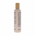 Shampoo bottle with beige cap on a white background