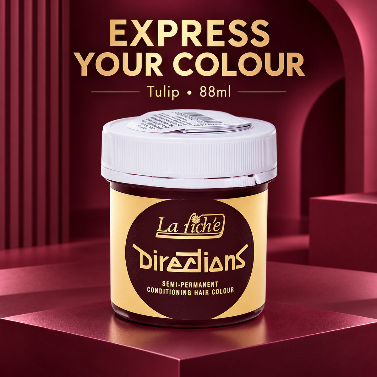 A jar of La Riché Directions semi-permanent conditioning hair colour in a deep tulip shade, displayed on a dark red platform with promotional text overlay.