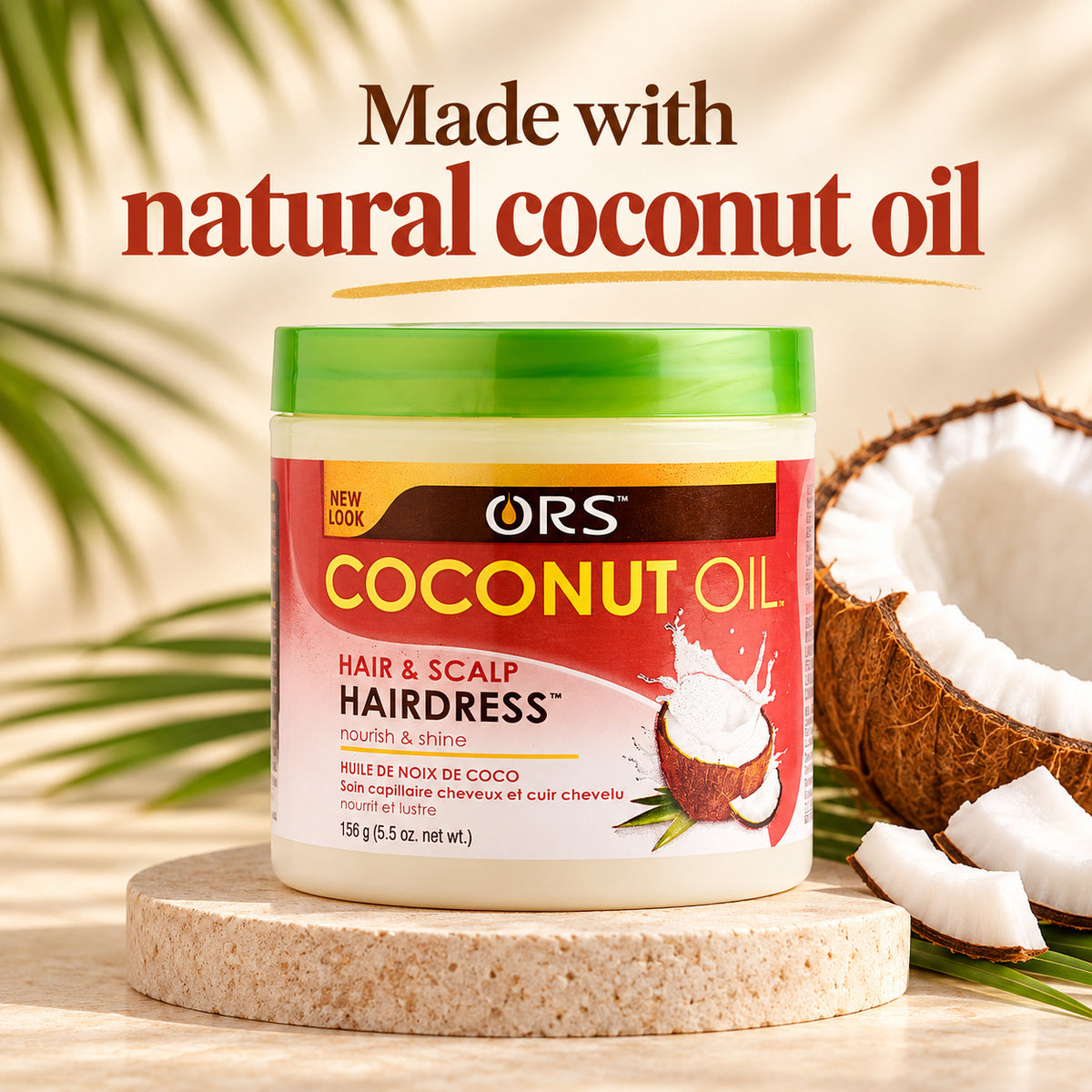 A jar of ORS Coconut Oil Hair & Scalp Hairdress cream sits on a round stone pedestal, with a cut coconut and coconut slices beside it. Large text at the top reads 'Made with natural coconut oil' against a warm beige background with soft leaf shadows.