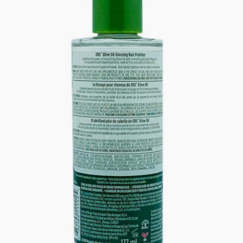 Bottle of hair product with green cap and label on a white background