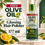 A bottle of ORS Olive Oil Frizz Control & Shine Glossing Hair Polisher stands on a stone pedestal with olive-themed props and large product text beside it. The bottle is clear with a green cap and green label accents, and the image includes sliced olives and green leaves around the setup.