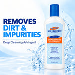 A bottle of Skinsuccess Deep Cleansing Astringent with a blue cap and white bottle, shown on a light blue water-splash background with large text reading 'REMOVES DIRT & IMPURITIES'.