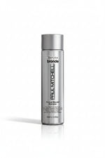 Shampoo bottle labeled 'Paul Mitchell' on a white background
