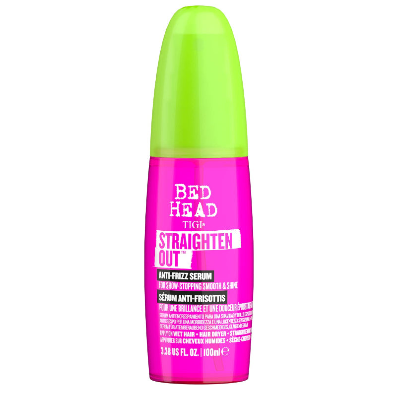 Pink and green serum bottle with 'Bed Head' branding on a white background
