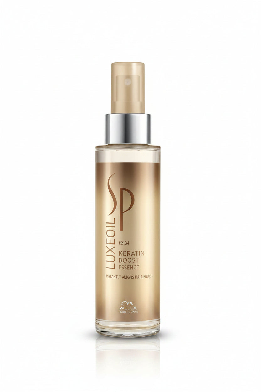 Wella SP Luxe Oil Keratin Boost Essence bottle on a white background