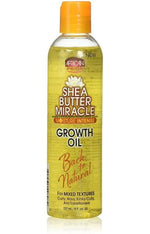 Shea butter miracle growth oil bottle with yellow label and orange cap on a white background