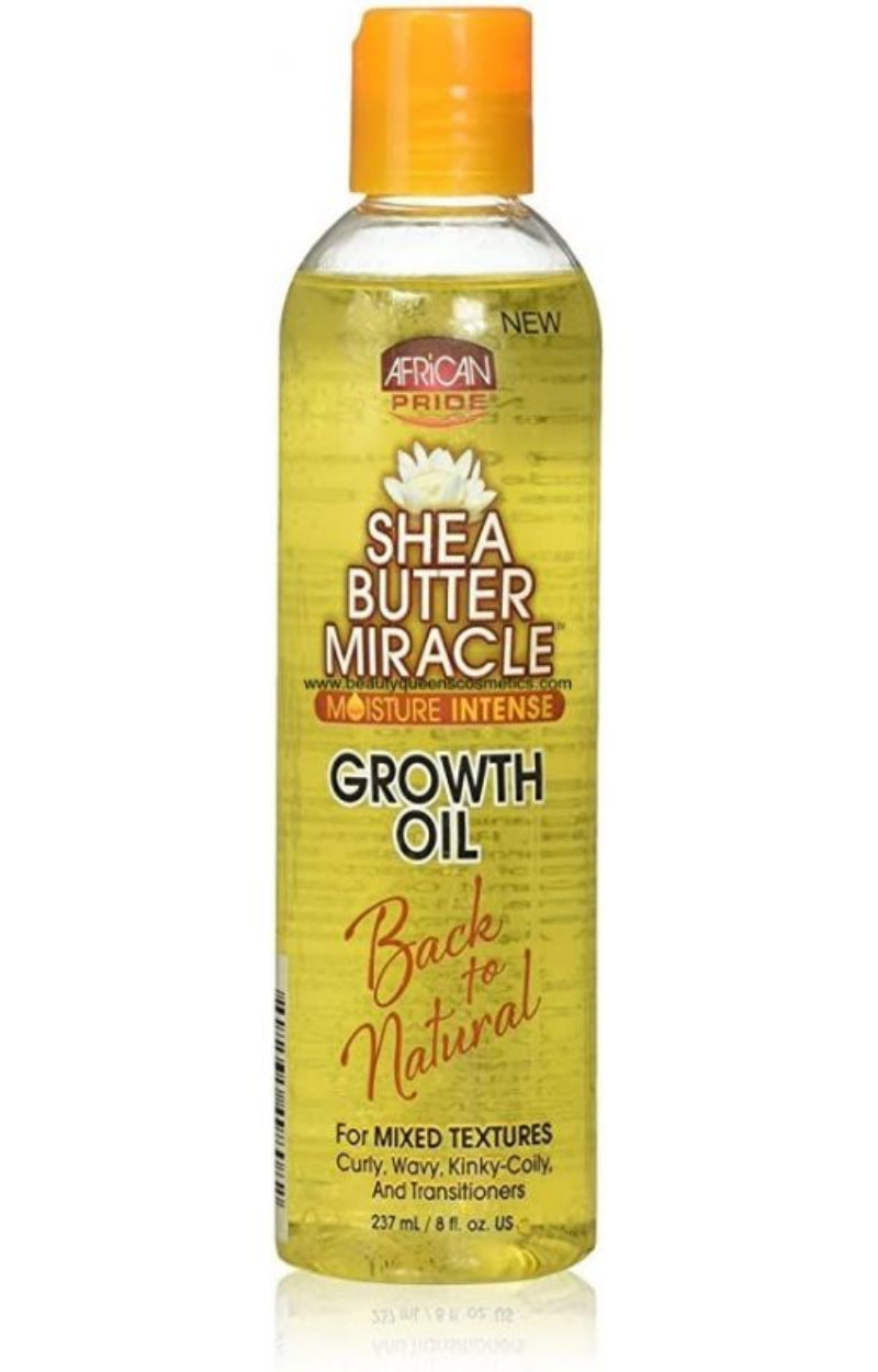 Shea butter miracle growth oil bottle with yellow label and orange cap on a white background