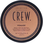 American Crew pomade container with brown label and black lid on a white background