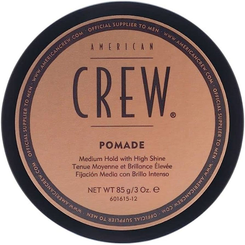 American Crew pomade container with brown label and black lid on a white background