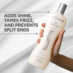 BIO SILK Silk Therapy shampoo bottle held by a hand with product benefits text on a gray background