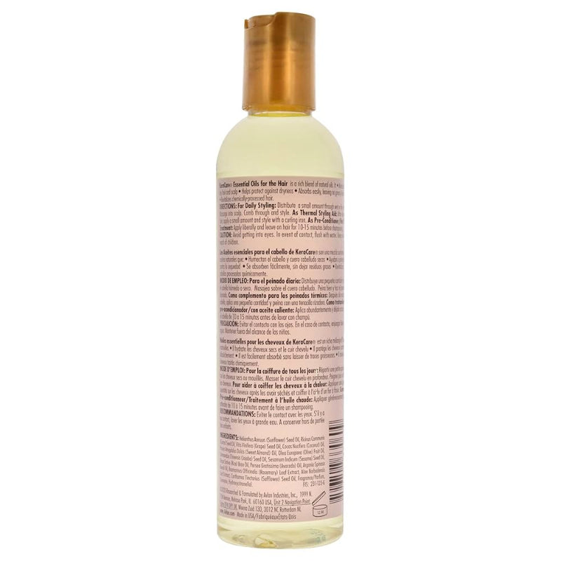 Bottle of hair care product with gold cap on a white background