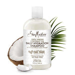 SheaMoisture coconut oil shampoo bottle with a coconut and palm leaf on a white background
